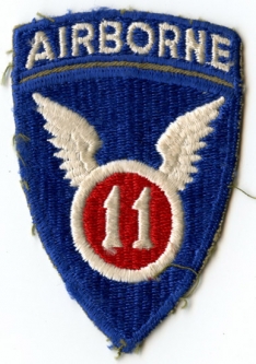 WWII US Army 11th Airborne Shoulder Patch with Integral Tab in Olive Drab Twill