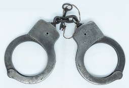 Great Old "Been There" Peerless Handcuffs with original Key