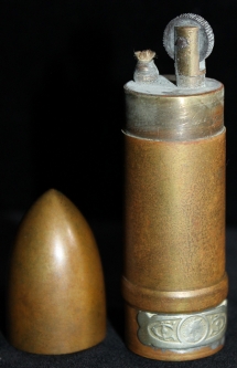 WWI era French Cigarette Lighter in Bullet Shape Souvenir De France on bottom Nickel Tax Badge