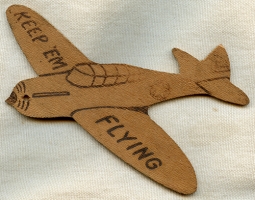 Cool WWII Home Front Wooden Cut Out of a Fighter Aircraft w/ KEEP 'EM FLYING Across Wings