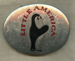 Classic Little America Hotels Adv. Buckle featuring "Emperor" the Penguin.