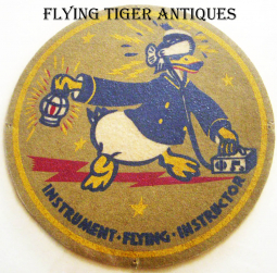 WWII USAAF Flight Instructor Lot: ACTS Badge, Donald Duck Patch, Tech Badge Link Trainer Bar, Tags