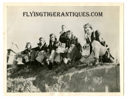 Great January 1943 Press Photo of USAAF Fighter Pilots Holding their Newly Issued Chinese Blood Chit